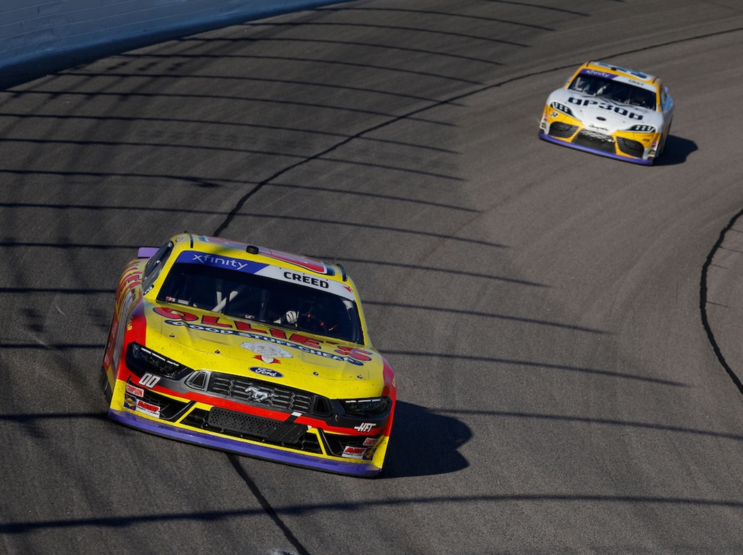 NASCAR Xfinity Series Sheldon Creed (00) races ahead of Taylor Gray at Kansas Speedway. (David Rosenblum/Nigel Kinrade Photography)